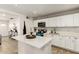 Well-lit kitchen featuring white cabinetry, modern appliances, and white countertops with an island at 699 W Shannon St, Chandler, AZ 85225