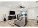 Comfortable living room featuring a ceiling fan, a plush sofa, and lots of natural light at 699 W Shannon St, Chandler, AZ 85225