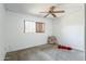 Neutral bedroom with carpet, ceiling fan, and natural light at 8355 E Thomas Rd, Scottsdale, AZ 85251