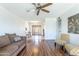 Spacious living room with hardwood floors, ceiling fan and abundant natural light at 8355 E Thomas Rd, Scottsdale, AZ 85251