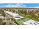 Scenic aerial view of the community featuring a tennis court, a pool, and lush landscaping at 9090 N 86Th Pl, Scottsdale, AZ 85258