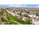 Scenic aerial view showing green space with a walking path and residences in the community at 9090 N 86Th Pl, Scottsdale, AZ 85258