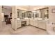 Bathroom with a spacious vanity area featuring dual sinks and lots of mirrors at 9090 N 86Th Pl, Scottsdale, AZ 85258