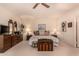 Spacious bedroom with neutral carpet, ceiling fan, and traditional furniture creating a relaxing retreat at 9090 N 86Th Pl, Scottsdale, AZ 85258