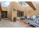 Private courtyard featuring outdoor seating, brick accents, and stylish desert landscaping at 9090 N 86Th Pl, Scottsdale, AZ 85258