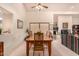 Bright dining room featuring a ceiling fan, artwork and a rustic table for gathering at 9090 N 86Th Pl, Scottsdale, AZ 85258