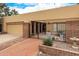 Cozy home exterior featuring a private, gated entrance, a 2-car garage and desert landscaping at 9090 N 86Th Pl, Scottsdale, AZ 85258