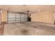 Spacious garage with an automatic door, ample storage, and plenty of room for vehicles at 9090 N 86Th Pl, Scottsdale, AZ 85258