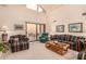 Bright living room with vaulted ceiling, and slider leading to a patio area at 9090 N 86Th Pl, Scottsdale, AZ 85258