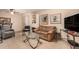 Cozy living room featuring tile floors, natural light, and comfortable seating at 9090 N 86Th Pl, Scottsdale, AZ 85258