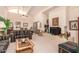 Inviting living room with vaulted ceiling, fireplace, and comfortable furnishings at 9090 N 86Th Pl, Scottsdale, AZ 85258