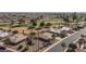 Aerial view of the neighborhood homes on the golf course featuring desert landscaping at 9309 W Briarwood Cir, Sun City, AZ 85351