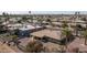 Aerial view of the neighborhood homes with desert landscaping and mature palm trees at 9309 W Briarwood Cir, Sun City, AZ 85351