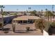 Inviting single-story home near golf course with desert landscaping and mature palm trees at 9309 W Briarwood Cir, Sun City, AZ 85351