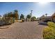 Expansive backyard featuring desert landscaping with golf course views at 9309 W Briarwood Cir, Sun City, AZ 85351