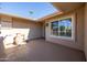 Welcoming front porch featuring a tiled floor, neutral paint, and a view of the exterior at 9309 W Briarwood Cir, Sun City, AZ 85351