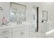 Stylish bathroom featuring dual sinks, quartz countertop, and modern finishes at 9370 E Wethersfield Rd, Scottsdale, AZ 85260