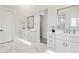 Elegant bathroom with marble floors, dual vanities, and modern fixtures at 9370 E Wethersfield Rd, Scottsdale, AZ 85260