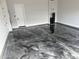 Spacious garage with epoxy floor and white walls at 9370 E Wethersfield Rd, Scottsdale, AZ 85260