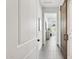 Hallway featuring tile floors and view to an adjacent living space at 9370 E Wethersfield Rd, Scottsdale, AZ 85260