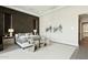 Beautiful bedroom showcasing the dark accent wall, stylish seating, and modern design elements at 9370 E Wethersfield Rd, Scottsdale, AZ 85260