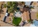 Overhead view showcasing the backyard with a trampoline, patio area, and mature landscaping at 99 W Circle Dr, Florence, AZ 85132