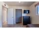 The bedroom features neutral colored walls, tile floors and an accent wall at 99 W Circle Dr, Florence, AZ 85132