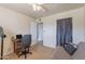 Bedroom featuring a ceiling fan, tile floor and convenient doorway access at 99 W Circle Dr, Florence, AZ 85132