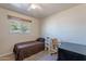 Cozy bedroom with natural light, neutral paint and tile flooring at 99 W Circle Dr, Florence, AZ 85132