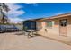 This lovely patio features a lounge area and easy access to the home at 99 W Circle Dr, Florence, AZ 85132