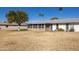 Back view of home featuring a screened in patio and mature landscaping at 10019 W Shasta Dr, Sun City, AZ 85351