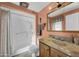 Bathroom features a shower, white vanity, and standard toilet in a light color scheme at 10019 W Shasta Dr, Sun City, AZ 85351