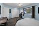 This bedroom features wood floors, a ceiling fan, and a standard closet at 10019 W Shasta Dr, Sun City, AZ 85351