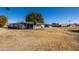 Low angle view of a well-maintained residential community with desert landscaping and clear blue skies at 10019 W Shasta Dr, Sun City, AZ 85351