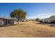 Exterior shot showing desert community featuring well-maintained lawns and clear blue skies at 10019 W Shasta Dr, Sun City, AZ 85351