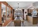 Elegant dining room with a chandelier, large windows, and stylish decor at 10019 W Shasta Dr, Sun City, AZ 85351