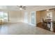 Bonus room with tile floors, neutral paint, ceiling fan, and a doorway to the living area at 10407 W Mission Ln, Sun City, AZ 85351