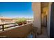 Inviting balcony with comfortable seating and charming flower boxes overlooking a scenic desert landscape at 10410 N Cave Creek Rd # 2007, Phoenix, AZ 85020