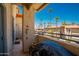 Private balcony offers views of the community, with palm trees and clear blue sky at 10410 N Cave Creek Rd # 2007, Phoenix, AZ 85020