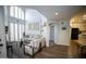 Bright living room features high ceilings and abundant natural light from large windows with wooden shutters at 10410 N Cave Creek Rd # 2007, Phoenix, AZ 85020