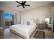 Comfortable bedroom with a large bed, neutral tones, balcony access, and scenic mountain views at 10410 N Cave Creek Rd # 2007, Phoenix, AZ 85020