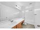 Bright bathroom with a large mirror, light wood vanity, and tiled shower at 110 N 66Th Ave, Phoenix, AZ 85043