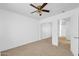 Bedroom featuring carpet, a closet with mirrored doors and an ensuite bathroom at 110 N 66Th Ave, Phoenix, AZ 85043