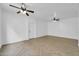 Spacious living room with two ceiling fans and light-colored herringbone flooring at 110 N 66Th Ave, Phoenix, AZ 85043