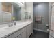 This bathroom features a bright white sink, large mirror and a shower/tub combination for relaxation at 1236 E Silver Reef Dr, Casa Grande, AZ 85122