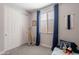 This cozy bedroom features a closet, plush carpet, a window with blinds, and blue accents at 1236 E Silver Reef Dr, Casa Grande, AZ 85122