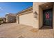 Beautiful home exterior featuring brick driveway, entry way, and decorated front door at 1236 E Silver Reef Dr, Casa Grande, AZ 85122