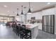 Beautiful kitchen with a large center island, stainless steel appliances, and modern lighting at 1236 E Silver Reef Dr, Casa Grande, AZ 85122