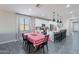 Open-concept kitchen with stainless steel appliances, large island, and gray wood floors at 1236 E Silver Reef Dr, Casa Grande, AZ 85122