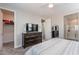 This airy main bedroom includes an entertainment center, bedroom furniture, and a walk-in closet at 1236 E Silver Reef Dr, Casa Grande, AZ 85122